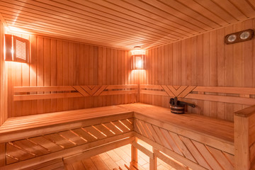 Obraz na płótnie Canvas sauna bathhouse warm interior inside empty brooms barrels bucket for water