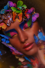 beautiful african girl surrounded by butterflies