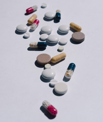 Many tablets on a white background, medicines, vitamins on a light background, pills