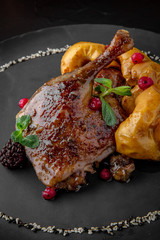 Duck legs baked with apples and cranberries with arugula salad. Healthy food