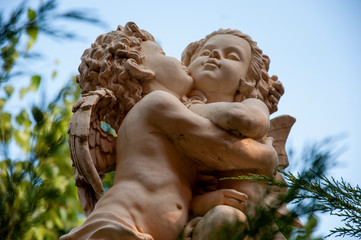 Fototapeta na wymiar Statue of angel. Beautiful sculpture in the park