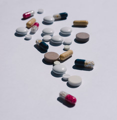 Many tablets on a white background, medicines, vitamins on a light background, pills