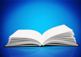 Open study book on blue background