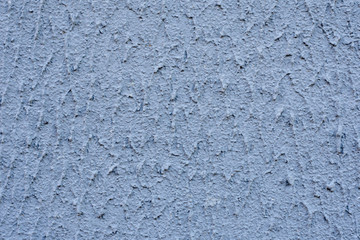 Fototapeta na wymiar The background of the texture of the textured plaster of graphite color