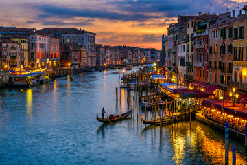 Grand Canal with gondolas in Venice, Italy. Sunset view of Venice Grand Canal. Architecture and...