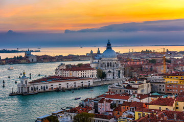 Fototapeta premium Aerial sunset view of Venice, Grand Canal and Basilica di Santa Maria della Salute in Venice, Italy. Architecture and landmarks of Venice. Venice postcard