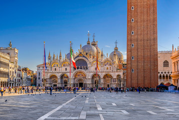 View of Basilica di San Marco and piazza San Marco in Venice, Italy. Architecture and landmark of Venice. Sunrise cityscape of Venice. - obrazy, fototapety, plakaty