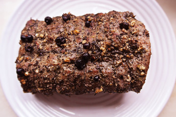 Beef and beef meat in a glass plate. Roast beef in spices. Cooking meat marinating in spices and herbs