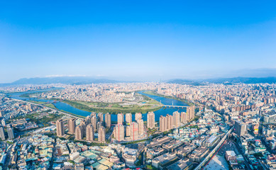 Taipei City Aerial View - Asia business concept image, panoramic modern cityscape building bird’s eye view under daytime and blue sky, shot in Taipei, Taiwan.