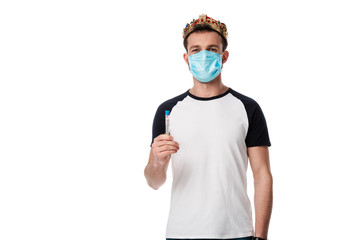 man in medical mask and crown holding test tube with coronavirus blood sample lettering isolated on white