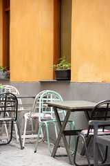 Outdoor cafe in Spain. Outdoor cafe in the old town. Summer cafe in the narrow old street. Vintage tables and decoration.
