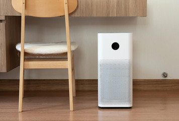 Indoor air purifier with digital monitor screen in bedroom, that show air quality in the room and...