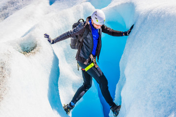 Man in front of an ice cave on the Perito Moreno 