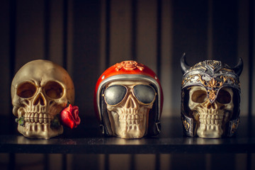 Set of three decor skulls in a tattoo studio.
