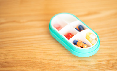 Dose pill box with medical pills. Top view. Flat lay. Copy space. Pharmaceutical medicine pills,...