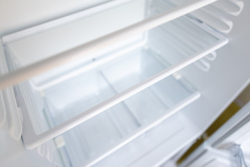 Empty shelves in refrigerator. The concept of diet and hunger