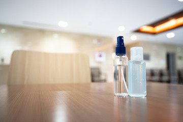 Coronavirus disease (COVID-19) prevention set, medical surgical face masks and hand sanitizer gel bottle for hand hygiene, health care concept.