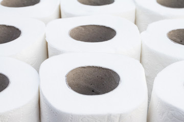 Clean white toilet paper against a white background. Roll of soft toilet paper isolated on white background.