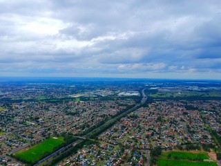 Fototapeta premium Above St Clair Drone panorama aerial view of Sydney NSW Australia city Skyline and looking down on all suburbs 