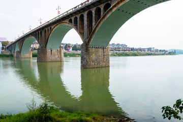 An arch bridge over a river