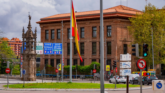 different images of a flag of spain waving in marques de vadillo with the bridge of toledo in the background
