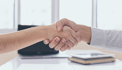 Fototapeta na wymiar Greeting and meeting, business partners as partners shaking hands to congratulate each other to work together, Building friendship in real estate investment , handshake concept.