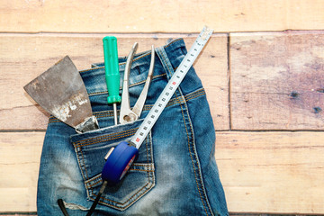 Set of tools for repair and construction on a wooden background