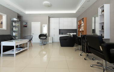 Interior of beauty salon with workplace and armchair for washing hair