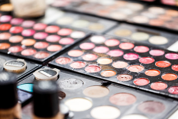 Used Cosmetics pallets close-up on the table. Close