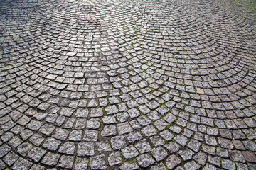 Cobblestone street in rounded shape of Paris Montmartre