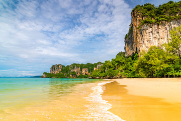 Panoramic view of Railay beach Krabi, Thailand. Beautiful tropical paradise with fresh blue water, hot sand and limestone rock above sea. Famous tourist and backpacker target for hiking and climbing