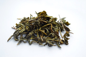 Green leaf tea on a white background.