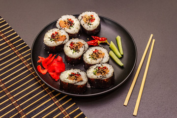 Korean roll Gimbap(kimbob). Steamed white rice (bap) and various other ingredients. Trendy black background