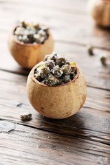 Salty capers in the woodeb bowl