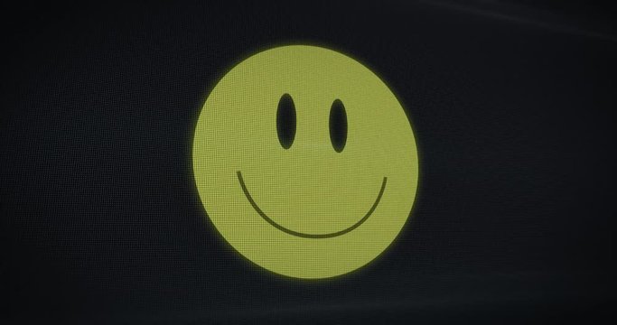 Huge grinning smiley emoticon on a TV screen. Image turns on and millions of pixels generate the image. Digitally generated animation.
