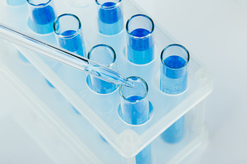 A pipette that adds fluid to one of several tubes. Lab tests