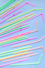 Colourful plastic straws on blue background. Cocktail tubes. Place for your text. Say no plastics. Plastic free concept.