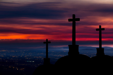 Catholic crosses silhouette with a darkness's sunset background. We live in dangerous times, this Easter stay home and pray for the coronavirus victims all over the world.