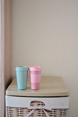
Two reusable plastic coffee cups