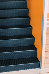  metal modern staircase and yellow walls in the office