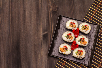 Korean roll Gimbap(kimbob). Steamed white rice (bap) and various other ingredients. Trendy black background