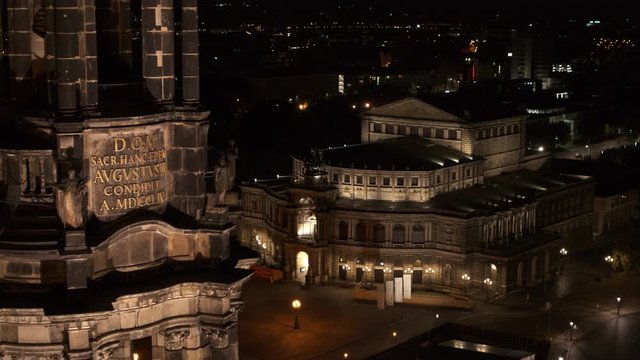 drone flight by night over the historic city of Dresden with the opera house Zwinger and the church dresden kreuzkirche