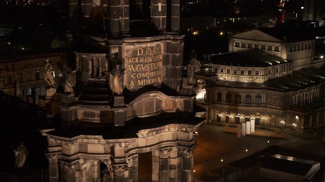 drone flight by night over the historic city of Dresden with the opera house Zwinger and the church dresden kreuzkirche