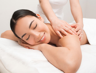 Obraz na płótnie Canvas Thai Massage therapy. Portrait asian woman enjoying massage at the spa.