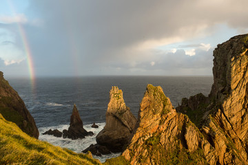 Tory Island North Coast with Eroded Cliffs and Sea Stacks during Rainbow © DorSteffen