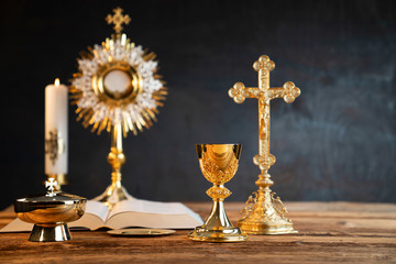 Catholic religion concept. Catholic symbols composition. The Cross, monstrance,  Holy Bible and...