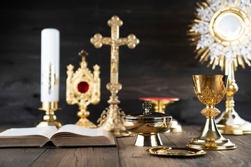 Catholic religion concept. Catholic symbols composition. The Cross, monstrance,  Holy Bible and...