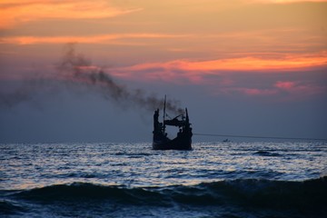 fishing boat at sunset
