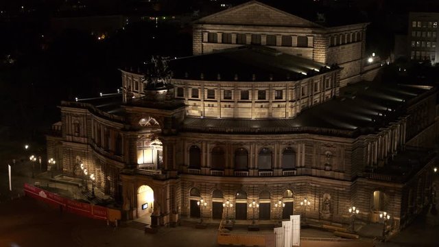 drone flight by night over the historic city of Dresden with the opera house Zwinger and the church dresden kreuzkirche