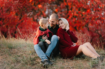 family in nature, autumn landscape,
 warm October, a blonde pregnant girl, mom waiting for a second berenka, husband and eldest son are happy, tenderness and hugs, love in the family